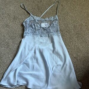 Free people dress with a clear laced top. Brand new.